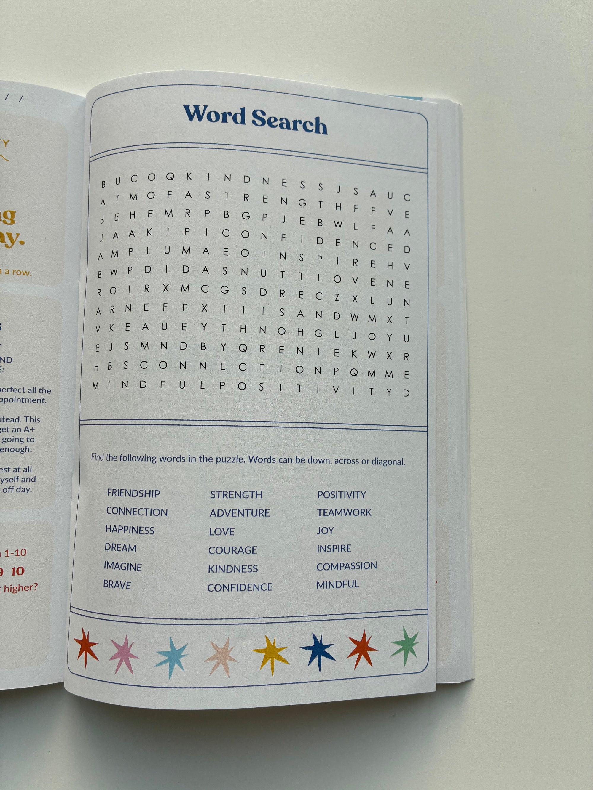 Open book with a word search puzzle on a plain background